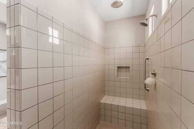 bathroom featuring tiled shower