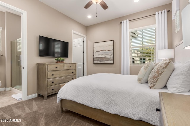 carpeted bedroom featuring connected bathroom and ceiling fan