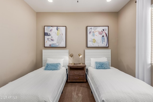 bedroom featuring dark colored carpet