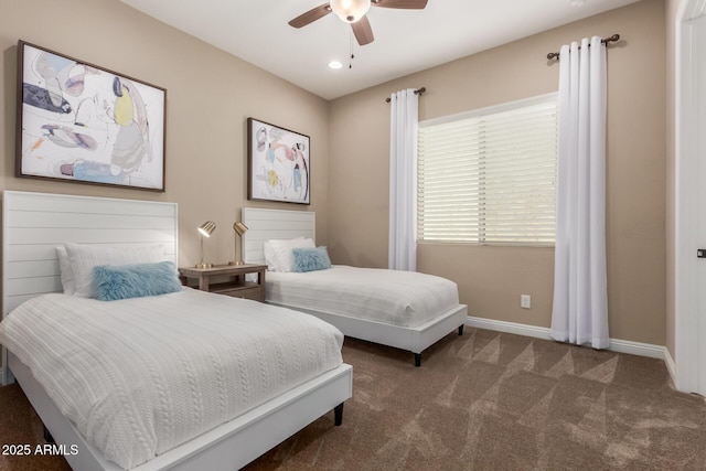 bedroom with ceiling fan and dark colored carpet