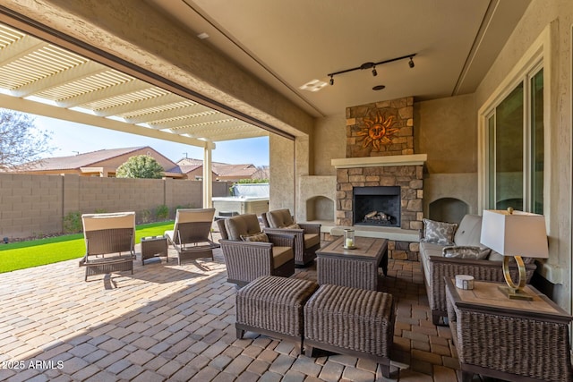 view of patio with an outdoor living space with a fireplace and a pergola