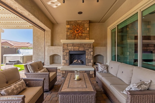 view of patio featuring an outdoor living space with a fireplace