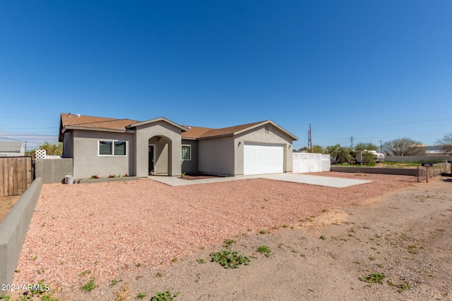 single story home with a garage