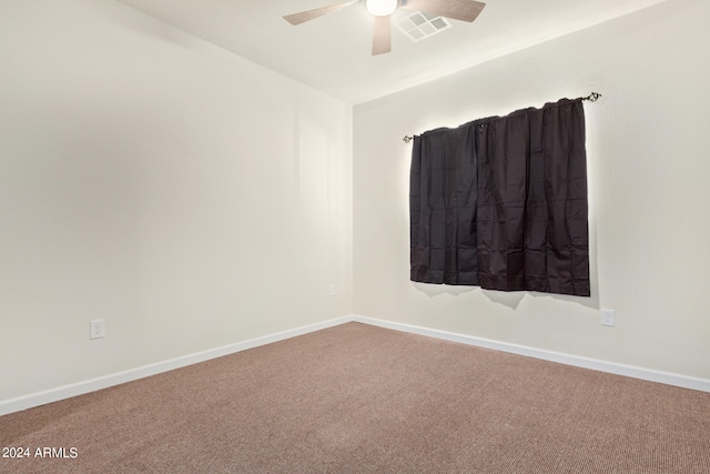 unfurnished room featuring carpet floors and ceiling fan