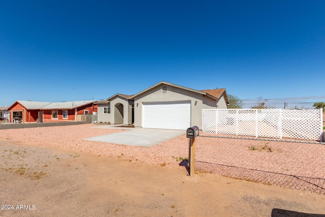 single story home with a garage