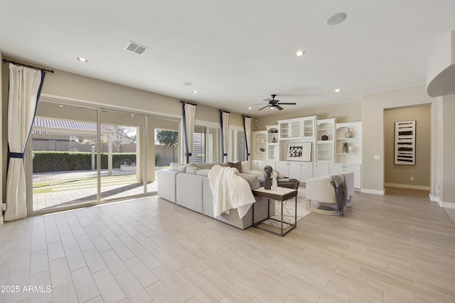 unfurnished living room with ceiling fan and light hardwood / wood-style floors