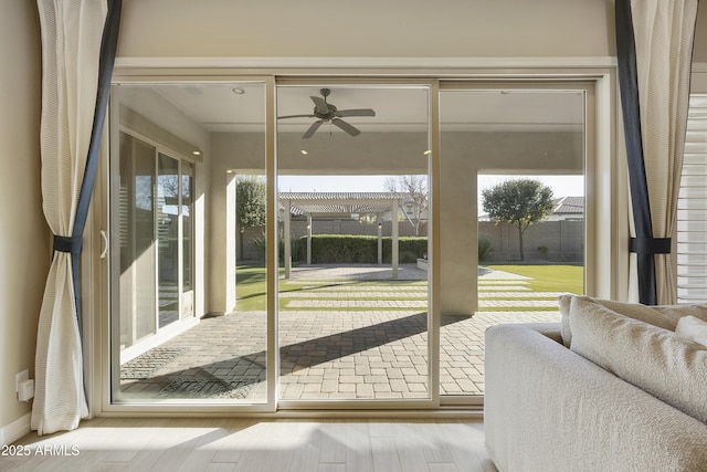 entryway featuring ceiling fan and light hardwood / wood-style floors