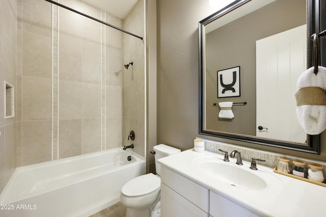 full bathroom with tiled shower / bath combo, vanity, and toilet