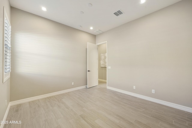 spare room with light wood-type flooring