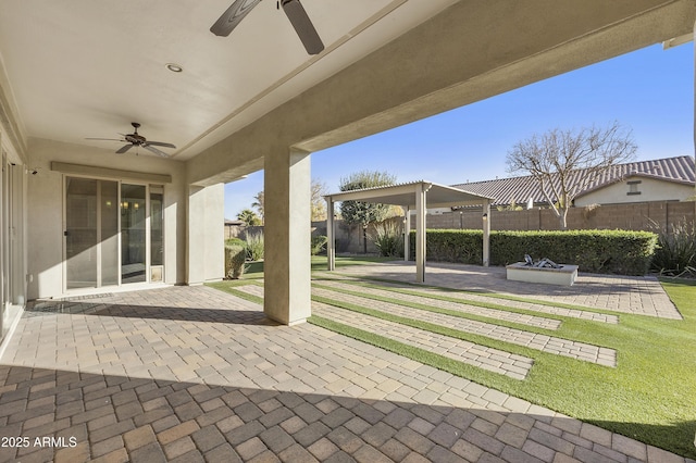 view of patio featuring ceiling fan