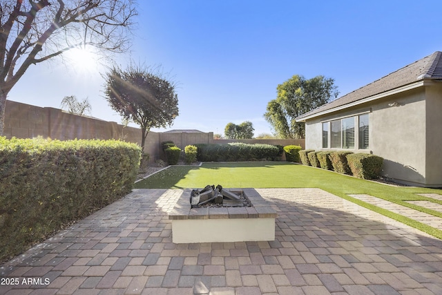 view of patio featuring a fire pit