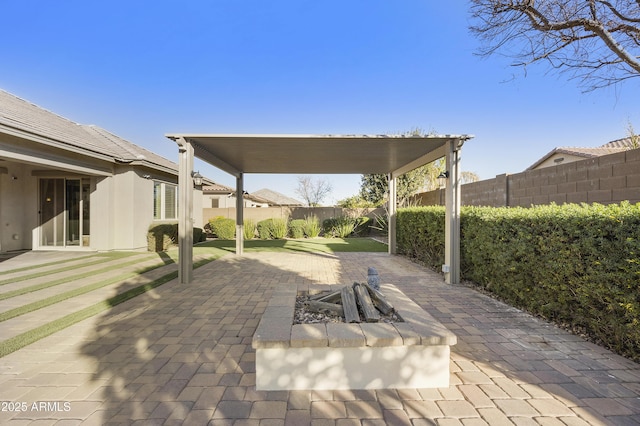 view of patio featuring a fire pit