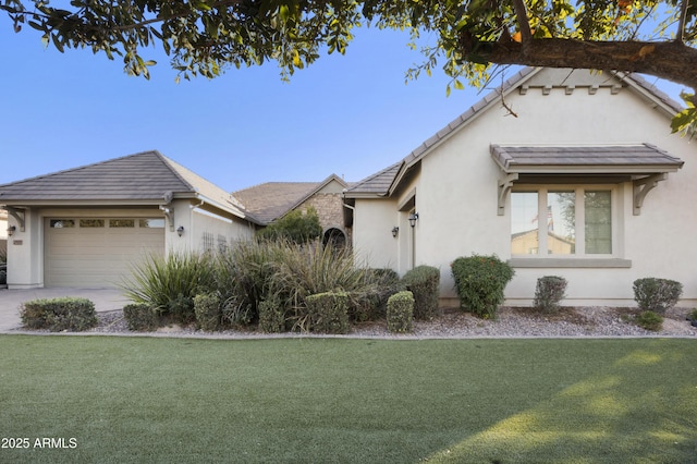 single story home with a garage and a front yard