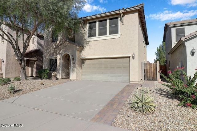 9009 S 57th Dr, Laveen, AZ 85339 - view of front of property featuring a tiled roof, a garage, concrete driveway, and stucco siding