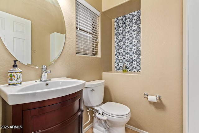 9009 S 57th Dr, Laveen, AZ 85339 - bathroom with toilet, vanity, and a textured wall