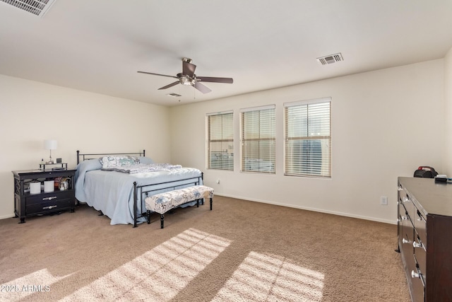 9009 S 57th Dr, Laveen, AZ 85339 - carpeted bedroom with a ceiling fan, baseboards, and visible vents