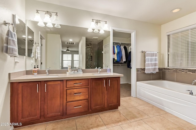 9009 S 57th Dr, Laveen, AZ 85339 - bathroom with visible vents, a sink, tile patterned floors, and a stall shower