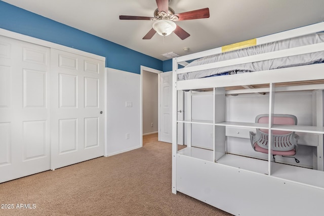 9009 S 57th Dr, Laveen, AZ 85339 - unfurnished bedroom with a closet, carpet floors, baseboards, visible vents, and ceiling fan