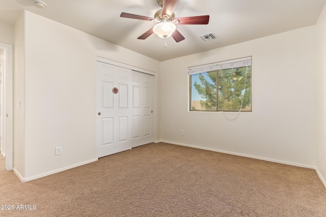 9009 S 57th Dr, Laveen, AZ 85339 - unfurnished bedroom with carpet flooring, baseboards, ceiling fan, visible vents, and a closet