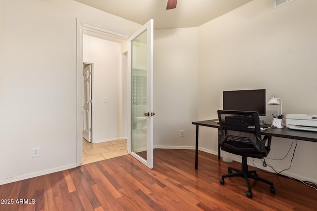 9009 S 57th Dr, Laveen, AZ 85339 - office space with french doors, baseboards, ceiling fan, and wood finished floors