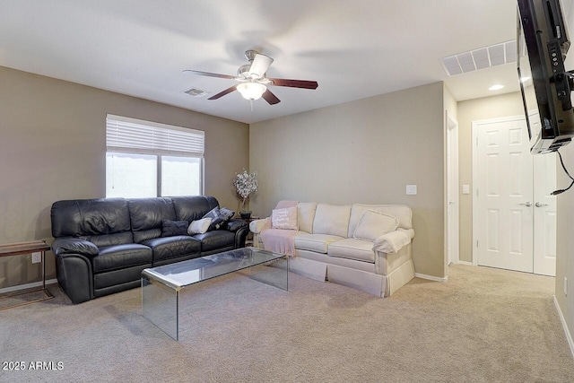 9009 S 57th Dr, Laveen, AZ 85339 - living area featuring baseboards, carpet flooring, visible vents, and a ceiling fan