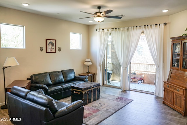 living area featuring visible vents, recessed lighting, ceiling fan, and wood finished floors