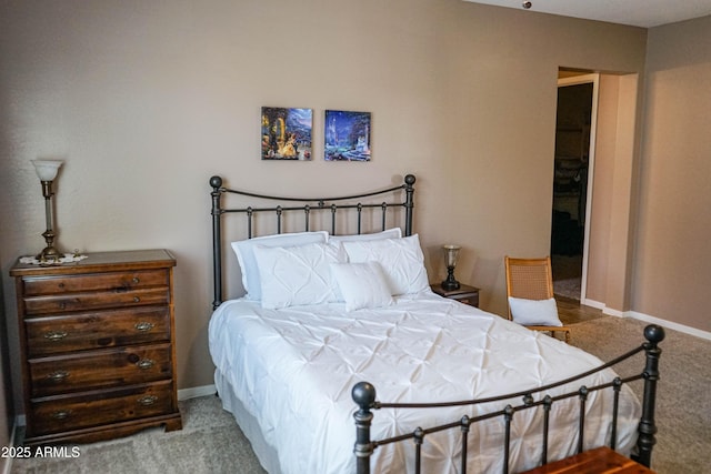 bedroom featuring baseboards and carpet floors