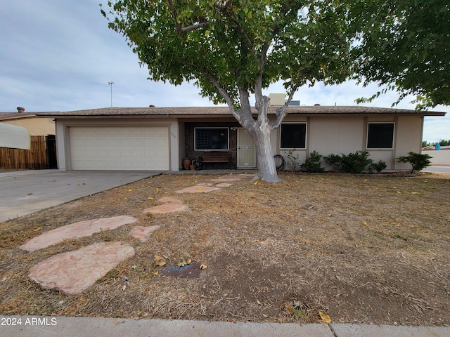 ranch-style house featuring a garage