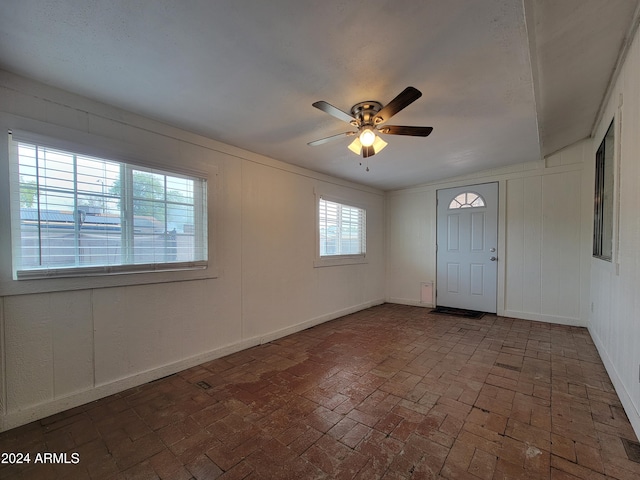 entrance foyer featuring ceiling fan