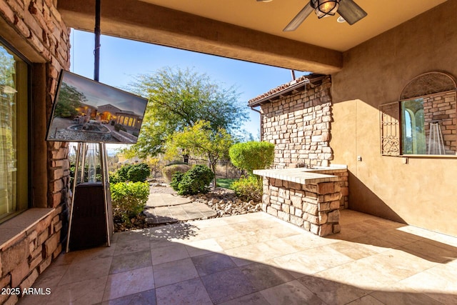 view of patio / terrace with ceiling fan