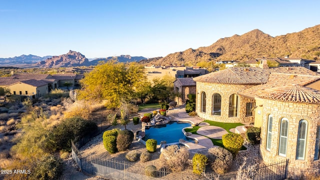 birds eye view of property with a mountain view