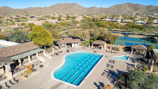 view of pool featuring a mountain view, a gazebo, and a patio