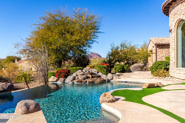 view of swimming pool with a patio area