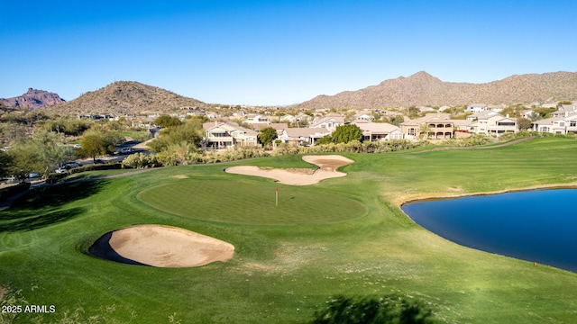 view of home's community featuring a water and mountain view