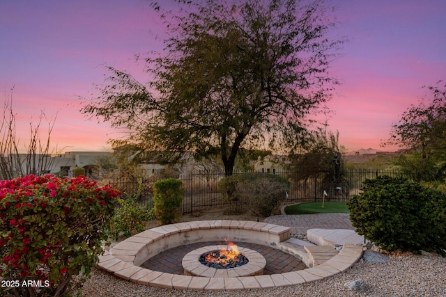 patio terrace at dusk with a fire pit