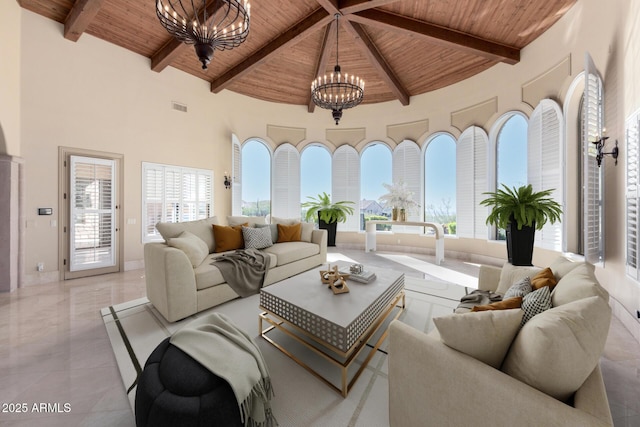 living room featuring beamed ceiling, high vaulted ceiling, wooden ceiling, and an inviting chandelier