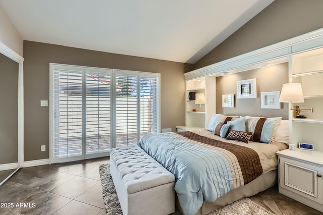 bedroom with light tile patterned flooring, access to exterior, and vaulted ceiling