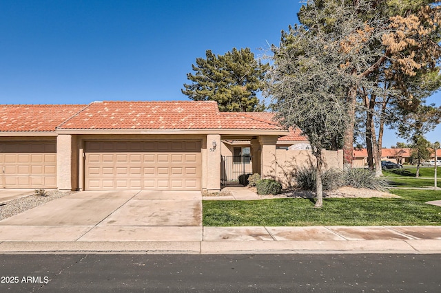 view of front of house with a garage and a front lawn