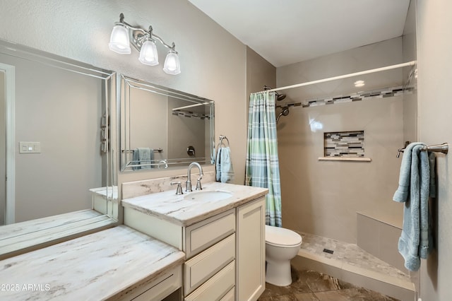 bathroom featuring a shower with curtain, vanity, and toilet