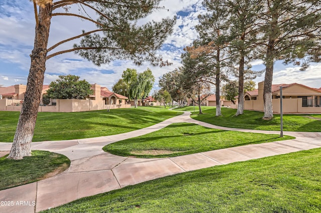 surrounding community featuring a lawn