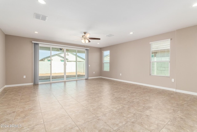 unfurnished room featuring baseboards, ceiling fan, and recessed lighting