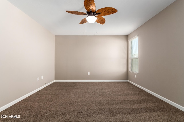 spare room with ceiling fan and carpet floors