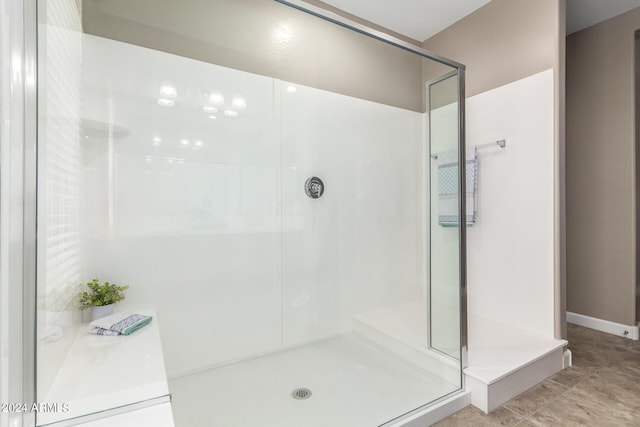 bathroom with a shower stall