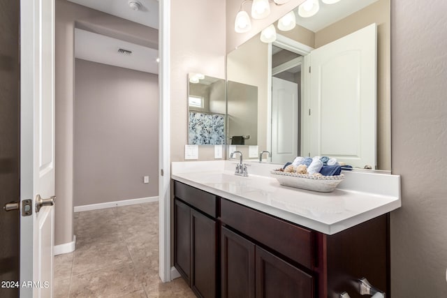 bathroom with vanity and tile patterned floors