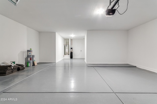 garage with a garage door opener and water heater