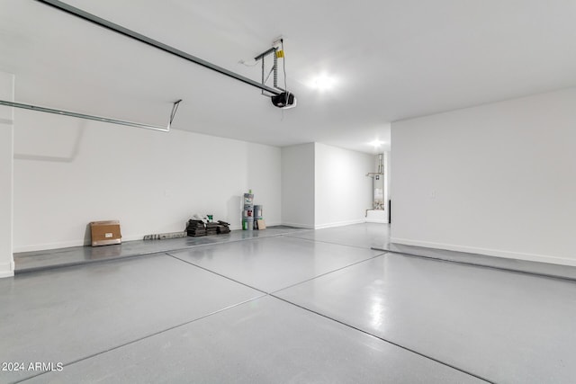 garage featuring baseboards and a garage door opener
