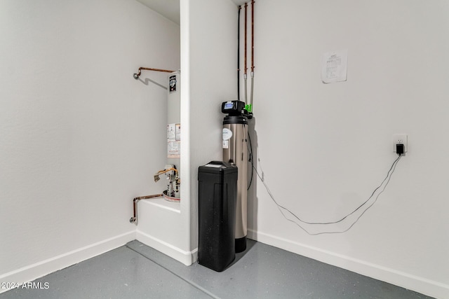 details featuring baseboards and gas water heater