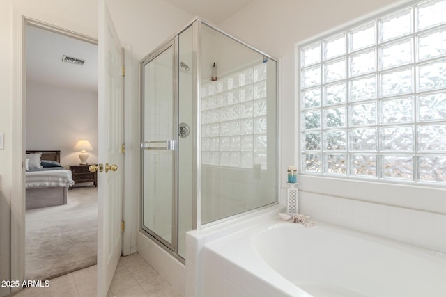 bathroom featuring a stall shower, tile patterned flooring, connected bathroom, and a bath