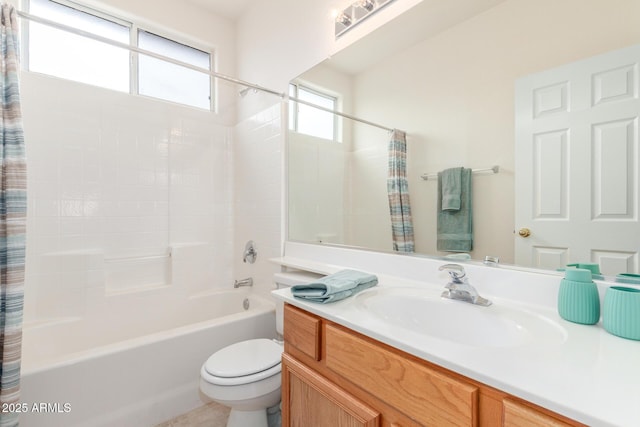 full bath with toilet, shower / tub combo with curtain, and vanity