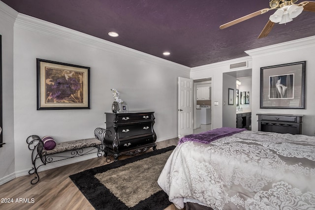 bedroom featuring washer / clothes dryer, connected bathroom, ceiling fan, ornamental molding, and hardwood / wood-style floors